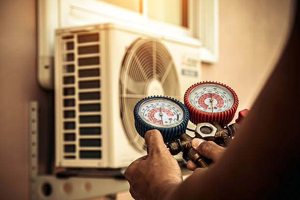 Professional Air Conditioning Service technician working in New Salisbury, IN